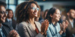 © Jasmina - Group of people applauding together in business meeting
