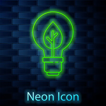 Glowing Neon Line Light Bulb With Leaf Icon Isolated On Brick Wall Background. Eco Energy Concept. Alternative Energy Concept. Vector