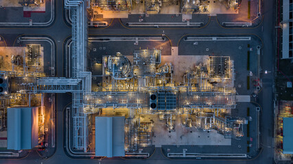 Canvas Print - Aerial view power plant for oil refinery petrochemical industrial, Oil  refinery factory power plant at night and pipeline steel, Oil refinery factory and power plant.