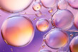 © Haydiddle - Purple and yellow soap bubbles in paint create an abstract design suitable for a colorful background.