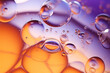 © Haydiddle - Purple and yellow soap bubbles in paint create an abstract design suitable for a colorful background.