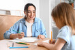 © Pixel-Shot - Young woman with her little daughter drawing at home