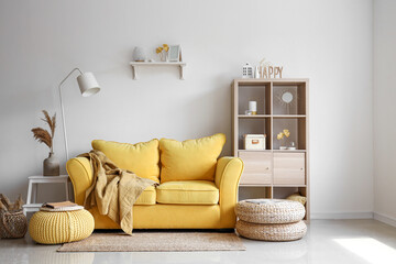 Poster - Interior of light living room with stylish yellow sofa and soft poufs