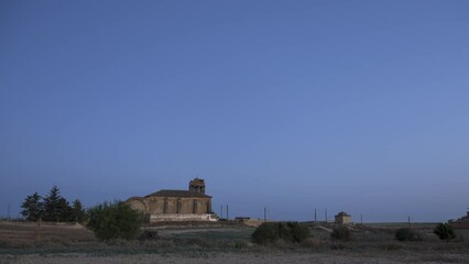 Wall Mural - the milky way moving across the night sky and an ancient church ruins. day to night time lapse