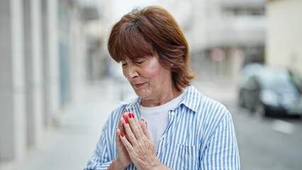 Wall Mural - Middle age woman sneezing at street