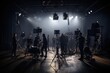 © amankris99 - Behind the shooting video production and film crew team. Silhouette of people in studio setting camera and lighting for shooting online video. Film production concept.