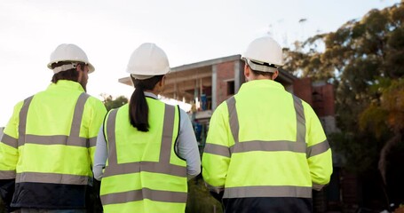 Wall Mural - Architecture, people or engineering team walking on construction site for building or maintenance. Back view, teamwork or architect in discussion, conversation or speaking of project management plan