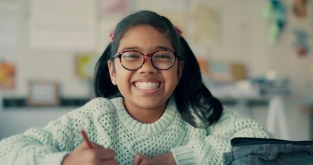 Canvas Print - Smile, face and a child in a classroom for education, learning or writing an exam at a desk. Happy, school and portrait of a girl or student with knowledge, studying and pride during a lesson