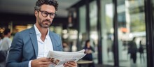Handsome Adult Man With Business Newspaper Focused Intently