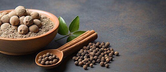 Aufkleber - Allspice on clay plate and wooden spoon on grey background