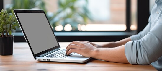 Sticker - Person using laptop with empty screen mockup at home for work