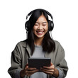 © Sona - Asian woman listening to music on tablet and dancing happily