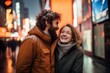 © Anne Schaum - Couple in their 30s smiling at the Times Square in New York USA