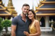 © Hanne Bauer - Couple in their 30s smiling at the Wat Phra Kaew in Bangkok Thailand