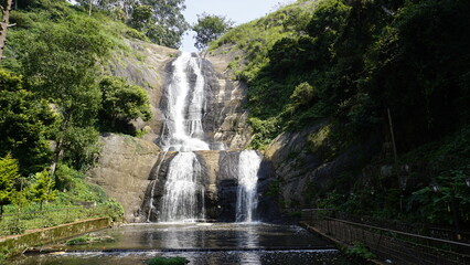 Wall Mural - scenic view of kodaikanal silver cascade water falls. Located in Top tourist attraction for family, friends and honeymoon destination