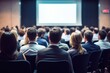 © id512 - students are watching a presentation, a conference hall brimming with individuals engaged in a business training session