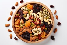 Mixed Dried Fruit And Nuts Trail Mix With Almonds, Raisins, Seeds Isolated On White Background, Top View, Copy Space 