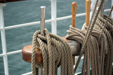 Ship Ropes Are Laid On The Rigging Of A Sailboat Against The Backdrop Of Sea Waves