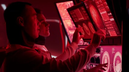 Wall Mural - Team of astronauts in a space suits aboard the Mars station. A crew of cosmonauts piloting the spaceship in space. Galactic travel and science.