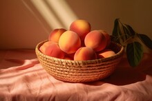 Peaches Arranged In A Woven Basket Sit Against A Soft Peach-colored Backdrop, With Shadows Adding Depth And Contrast.