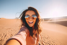 Happy Female Tourist Taking Selfie On Sand Dunes In The Egypt Desert, Sahara National Park - Influencer Travel Blogger Enjoying Trip While Takes Self Portrait 