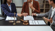© Phushutter - Legal consultation, asian lawyers team meeting post-contract, contract finalization, lawyers discussing agreements, contract review session, agreement assessment, legal experts in conversation