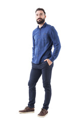 Wall Mural - Cool smiling guy, with hands in pockets looking up wearing blue denim shirt and pants. Full body isolated on transparent background.