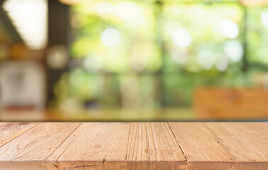 Sticker - Mock up for space. Empty dark wooden table in front of abstract blurred bokeh background of restaurant . can be used for display or montage your product