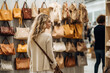 © GustavsMD - Smiling female standing near fashion bag shelves during Black Friday shopping with discounts, funny hipster girl enjoying pastime for update her wardrobe spending day in boutique