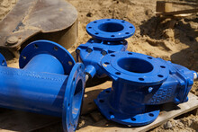 On The Construction Site There Is Sewage Equipment - A Tee And Blue Check Valves
