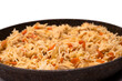 Tasty pilaf with chicken in a frying pan.