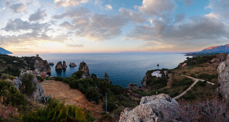 Canvas Print - Evening twilight view of beautiful Tyrrhenian sea bay and Faraglioni di Scopello from above, province of Trapani, Sicily, Italy.