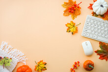 Autumn Office Workspace. Autumn Flat Lay Background. Keyboard, Laptop With Autumn Cloth And Fall Decorations - Pumpkin, Leaves And Other.