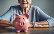 savings, money, annuity insurance, retirement and people concept - Senior woman hand putting coin into piggy bank