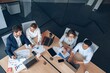 © Yaroslav Astakhov - topview of creative agency business brain storm meeting. Team discussing roadmap to product launch.