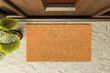 © Andy Dean - Overhead of blank doormat on the porch at the front door.
