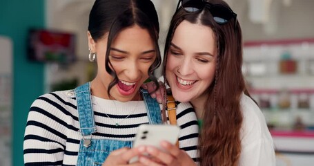 Happy, phone and girl friends in a store typing a text message on social media or mobile app together. Smile, networking and young women scroll on a internet website with cellphone in a retail shop.