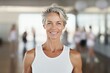 © radekcho - Mature woman standing in a fitness studio.