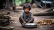 Hungry starving poor little child looking at the camera