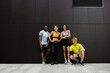 © Drobot Dean - Group of athletic people smiling while standing outdoors