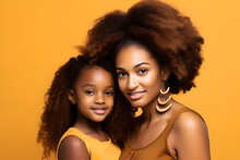 Portrait Of Beautiful African American Mother With Cute Little Daughter, Smiling And Looking To Camera With Isolated Yellow Background