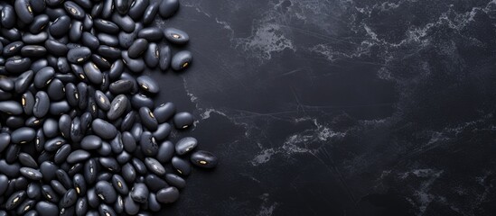 Aufkleber - Raw black beans on gray concrete horizontal top view blank area