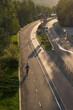 © nuclear_lily - Man bicycling on cycling road. Top aerial view.