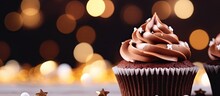 Close Up Of A Scrumptious Christmas Chocolate Cupcake On A Dark Bokeh Background