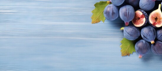 Aufkleber - Health food concept with ripe sweet figs on a blue plate surrounded by a wooden table