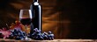 Red wine bottle and glass old snag backdrop blue grapes Space to copy