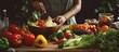 © vxnaghiyev - Young black woman cooking with organic food in kitchen closeup copy space available cutting fresh vegetables