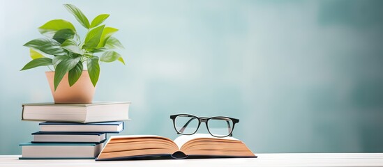 Wall Mural - a flat lay with a notepad reading glasses and a potted plant representing messages and reminders
