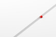 © Cagkan - Red sphere moving on or following a path on white background with copy space.