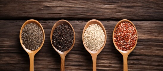 Aufkleber - Top down view of white red and black quinoa seeds on wooden background with room for text